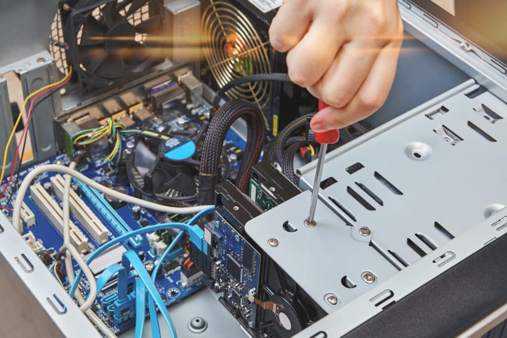 Technician performing computer repair in the Central Valley.